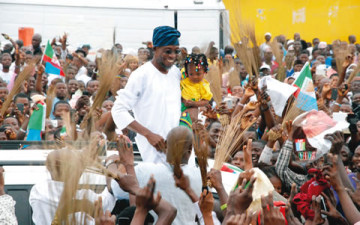 Governor-Rauf-Aregbesola-of-Osun-State-being-cheered-by-All-Progressives-Congress-supporters-at-the-Freedom-Park-Osogbo…-on-Sunday-360×225