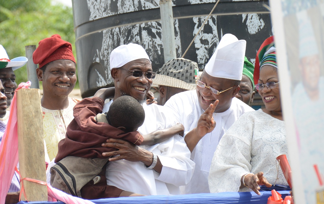 Aregbesola with a Toddler-1