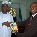 PHOTO NEWS: Aregbesola Receieves A Book Entittled GMB Phenomenon