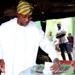 PHOTO NEWS: Gov. Aregbesola, His Mother And Wife Casting Votes