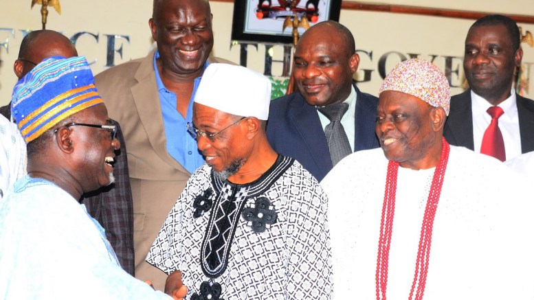 Governor-Aregbesola-exchanging-pleasantries-with-the-Chairman-of-LAUTECH-Governing-Board-Professor-Oluwole-Atoyebi-while-Aragberi-of-Iragberi-Oba-Folorunso-Agboade-Makanju-and-others-watch